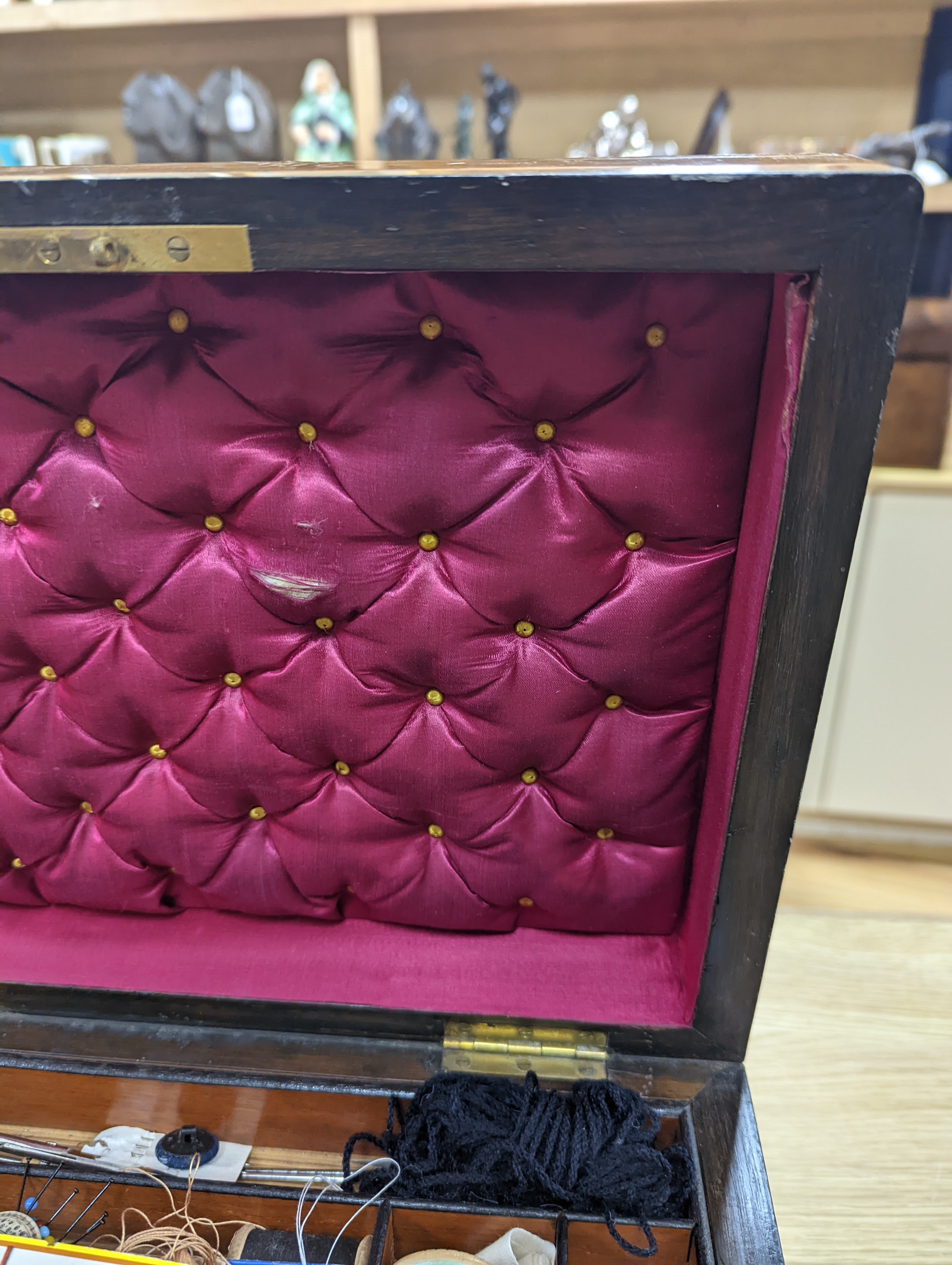 A Victorian walnut sewing casket, 34cm, containing sewing related accessories